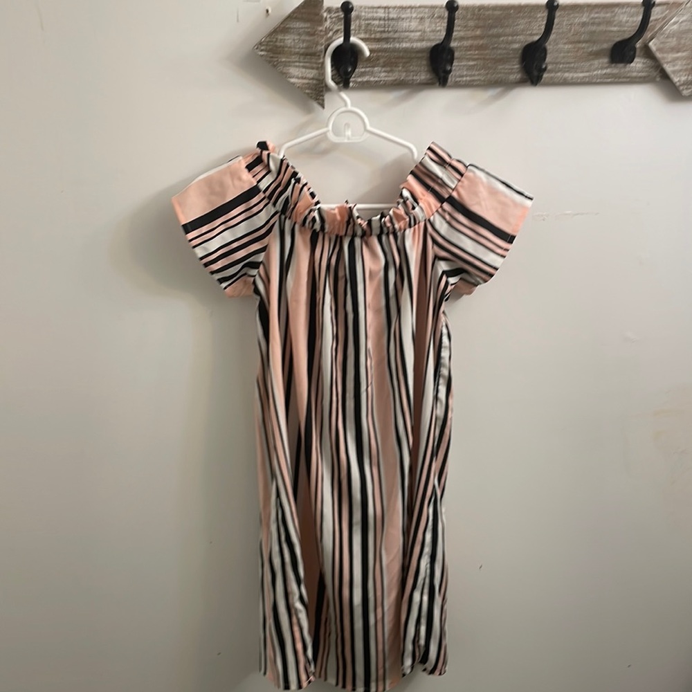 This dress is a size 4 women’s and it is from the brand atmosphere